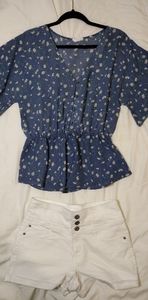 Delicate blue blouse with white shorts